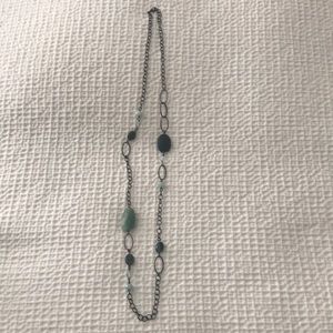 Long chain link necklace with green stones